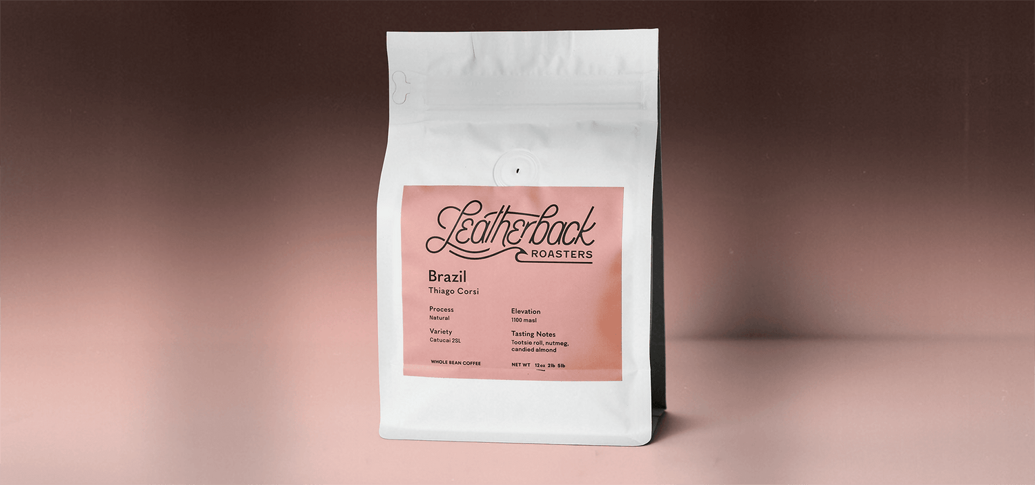 12oz White Valved Coffee Bag, sitting on a pink gradient backdrop, with light shadows