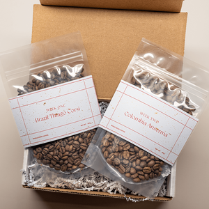 Two coffees in clear bags with holiday packaging