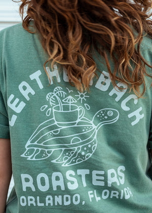 Unisex graphic tee with turtle design on back. Reads "Leatherback Roasters Orlando, Florida."