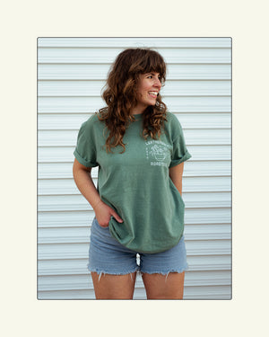 Leatherback Roasters tee shirt. Sage green sea turtle shirt front print. Grace is wearing a Large.